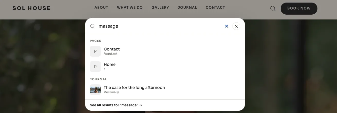 A search panel dropped from a storefront's header over its dimmed hero photo, with the word massage typed in — the two matching pages listed under Pages, a journal post with its thumbnail under Journal, and a link at the foot to see all results for it.